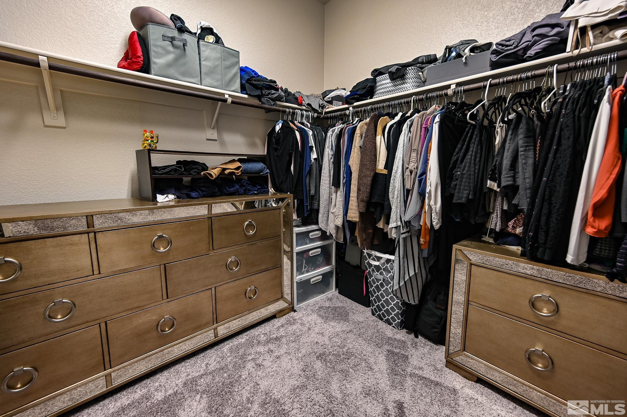 9330 Mayfair Way Reno, NV 89521 - Photo 35 of 40 a view of walk in closet with clothes and shoes