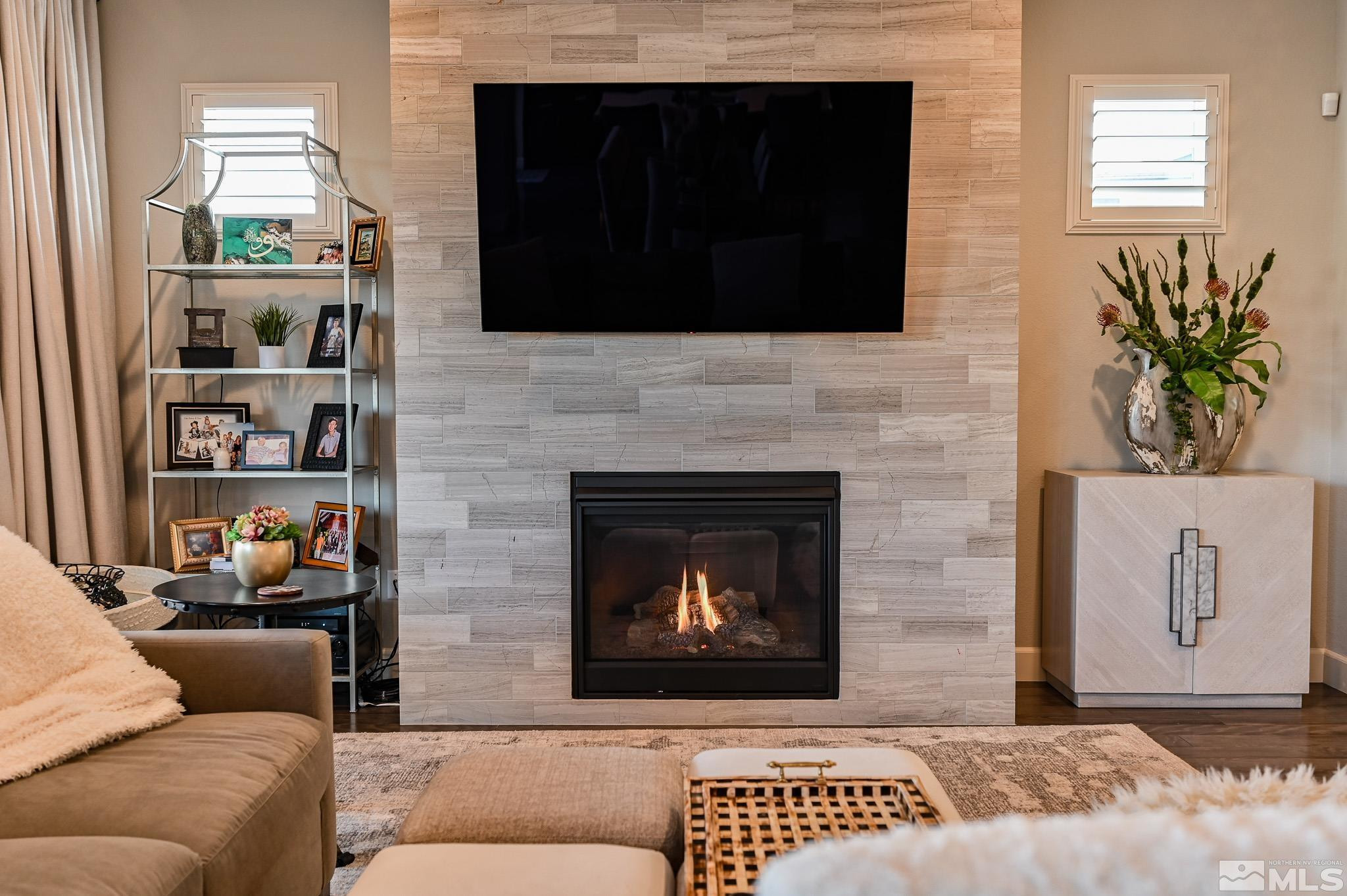 9330 Mayfair Way Reno, NV 89521 - Photo 7 of 40 a living room with furniture and a fireplace