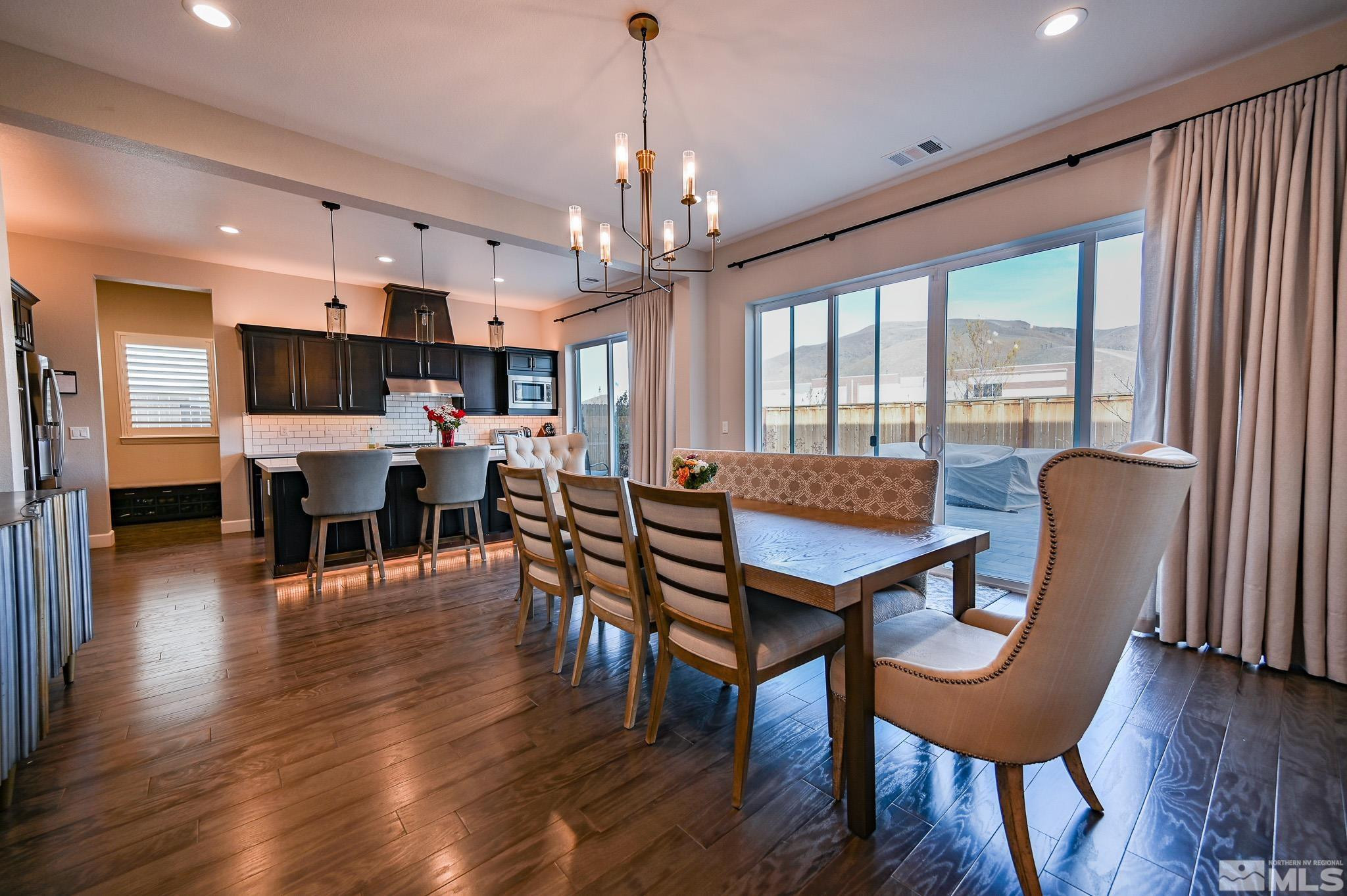 9330 Mayfair Way Reno, NV 89521 - Photo 10 of 40 a view of a dining room with furniture window and wooden floor