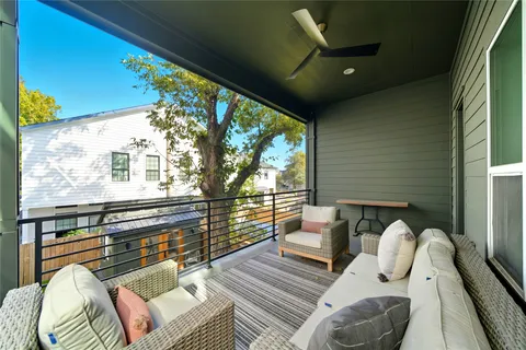 a view of living room with furniture and a large window