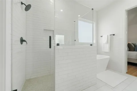 a bathroom with a toilet and shower