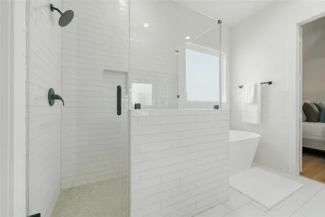 a bathroom with a toilet and shower