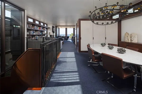a living room with furniture and a shelf