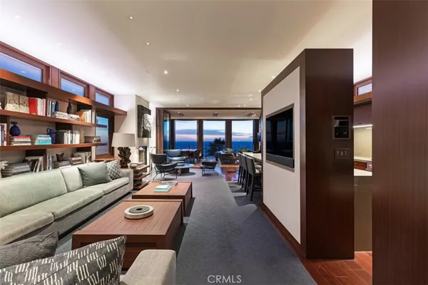 a kitchen with kitchen island a counter space a sink and a stove