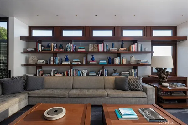 a living room with furniture a fireplace and a piano
