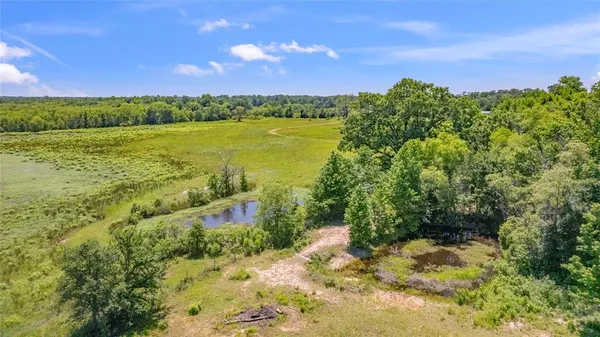 a view of a lake with a yard