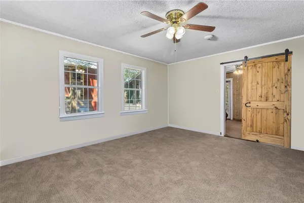 a view of an empty room with a window