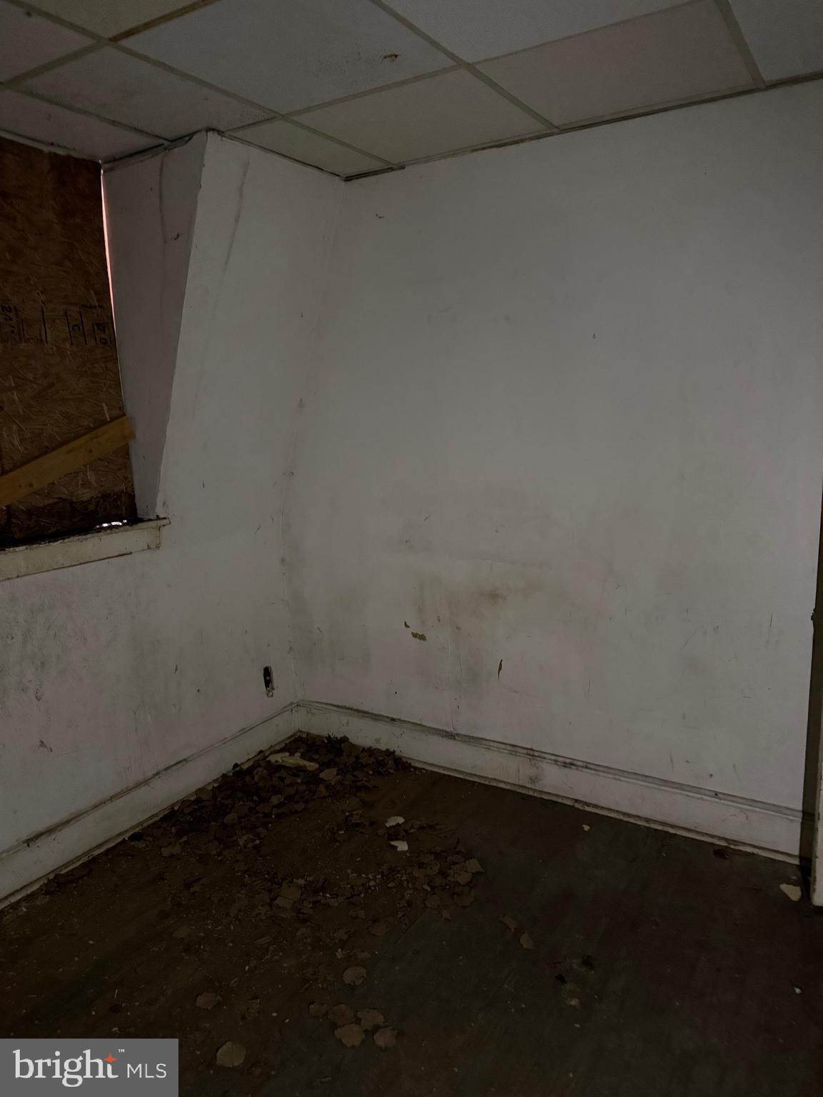 1119 Brown Street Chester, PA 19013 - Photo 12 of 18 a view of a room with an empty space and a window