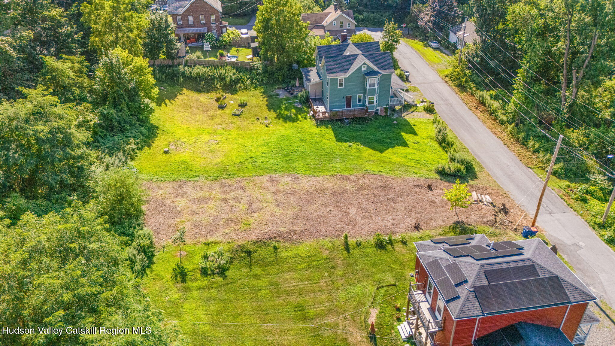 635 Third Avenue Port Ewen, NY 12466 - Photo 7 of 9 an aerial view of a house with a yard basket ball court and outdoor seating