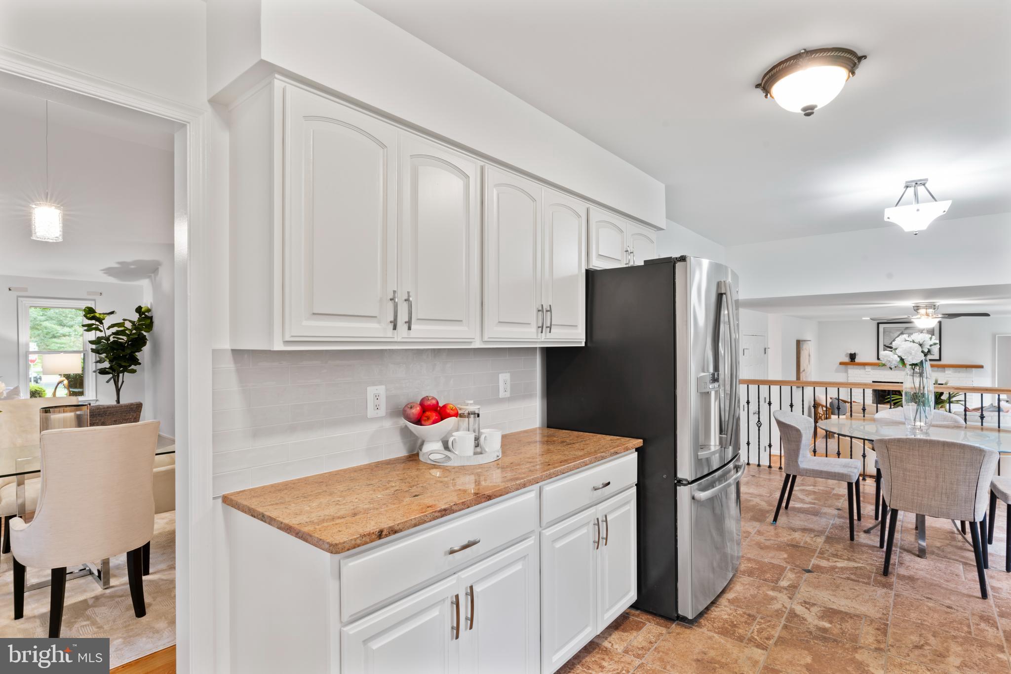 1950 Weybridge Lane Reston, VA 20191 - Photo 13 of 71 a kitchen with stainless steel appliances granite countertop a refrigerator sink and cabinets
