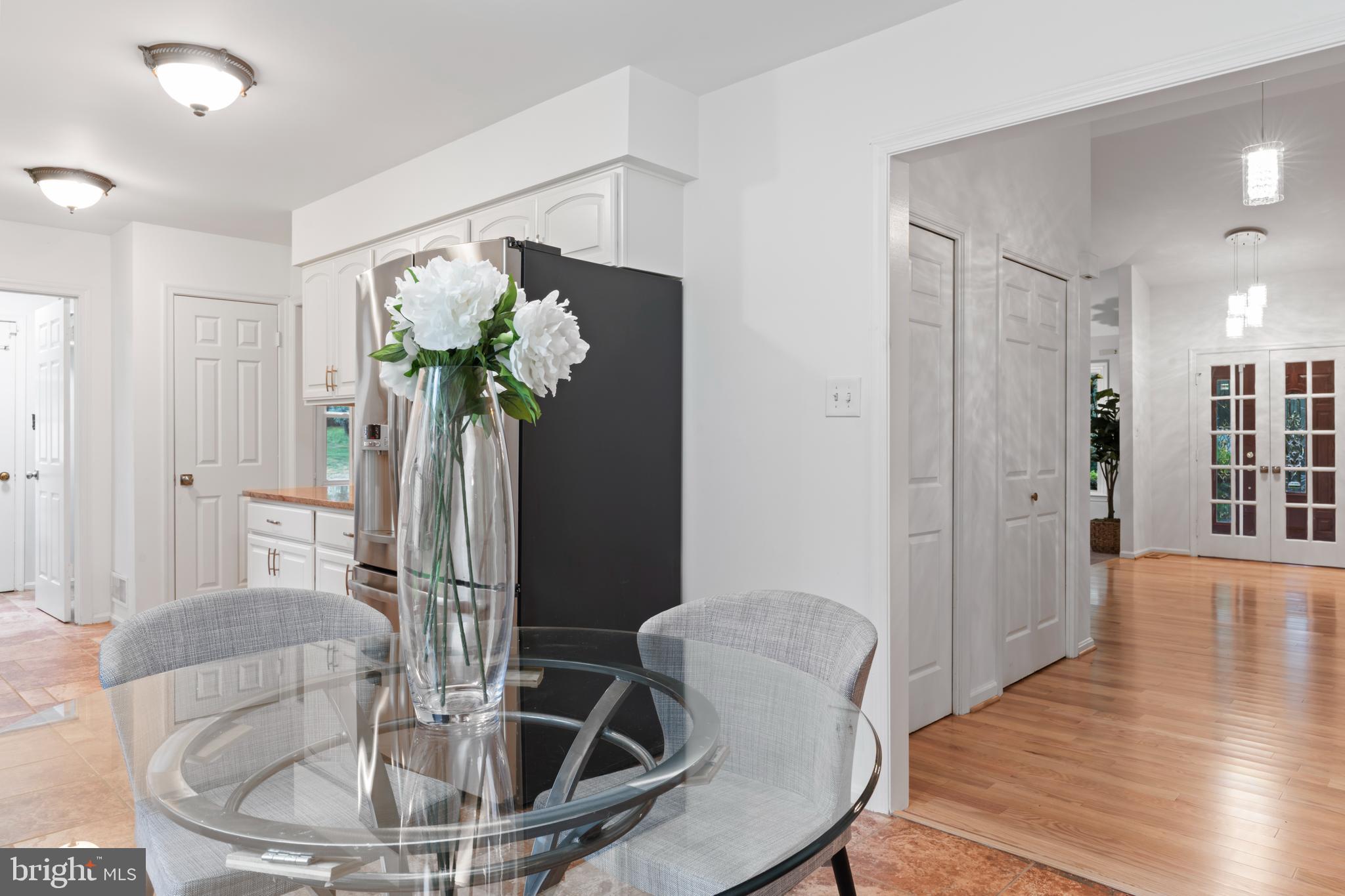 1950 Weybridge Lane Reston, VA 20191 - Photo 17 of 71 a dining room with furniture and wooden floor