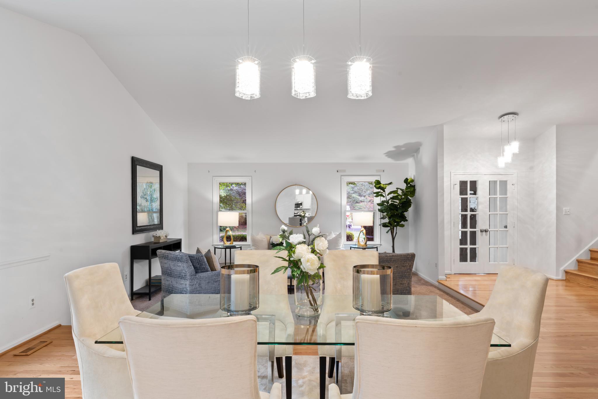 1950 Weybridge Lane Reston, VA 20191 - Photo 20 of 71 a dining room with wooden floor and large mirror