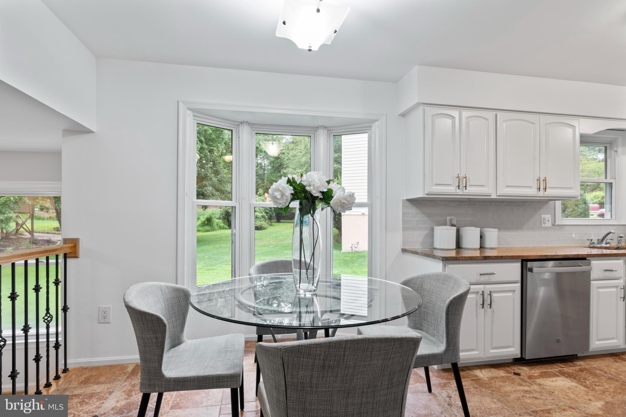 1950 Weybridge Lane Reston, VA 20191 - Photo 21 of 71 a view of a dining room with furniture window and outside view