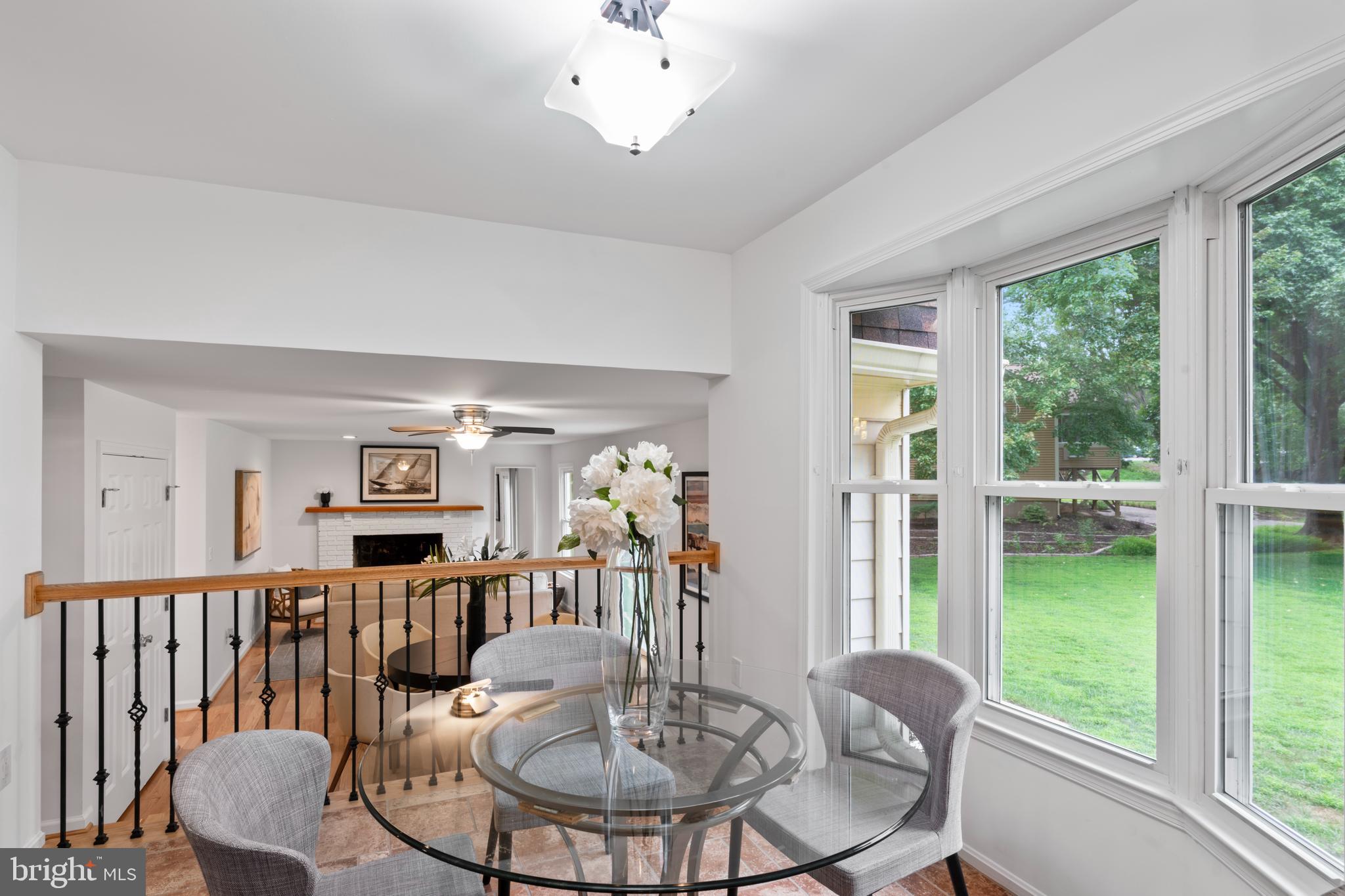 1950 Weybridge Lane Reston, VA 20191 - Photo 22 of 71 a view of a dining room with furniture window and outside view