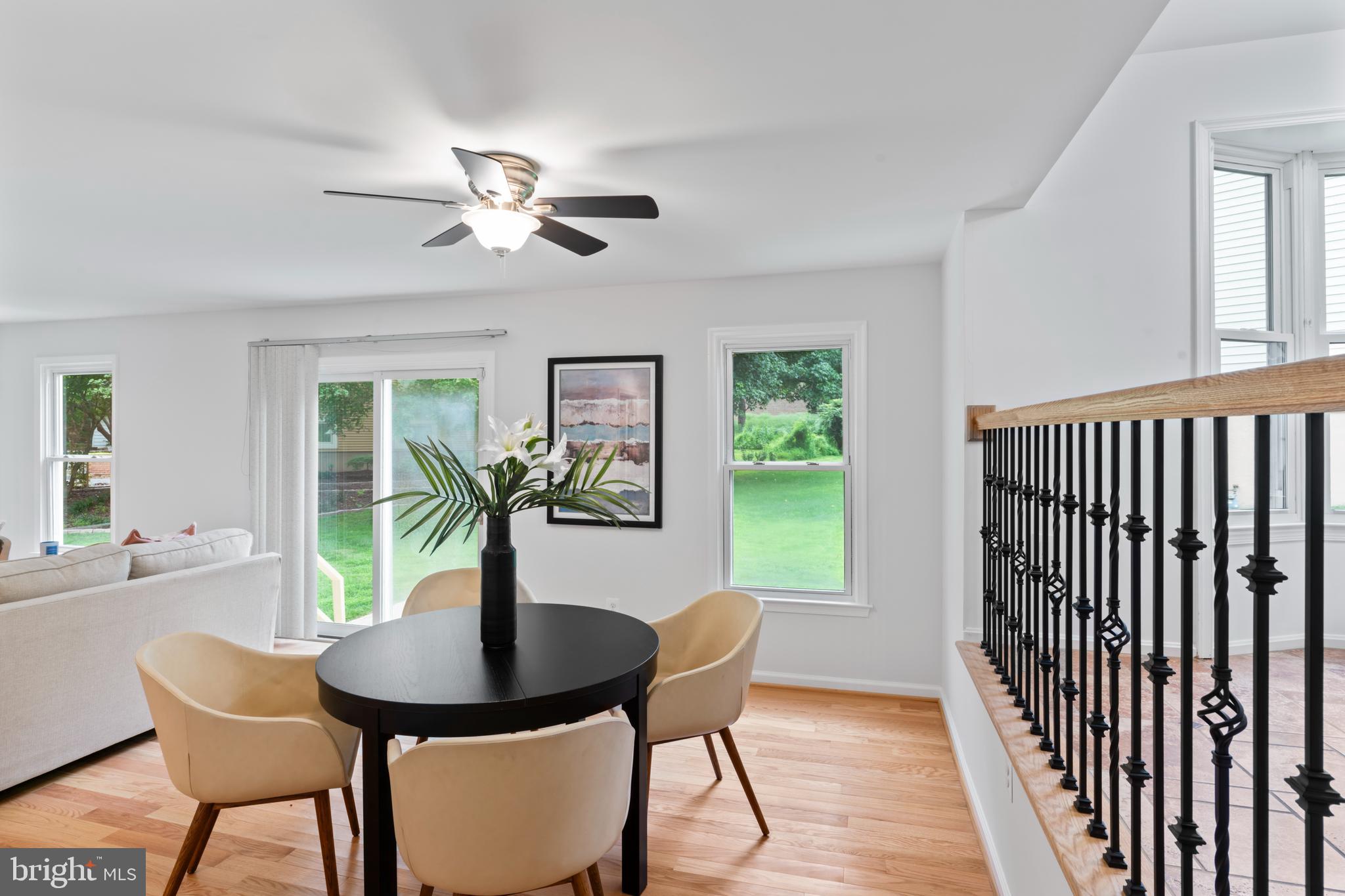 1950 Weybridge Lane Reston, VA 20191 - Photo 23 of 71 a dining room with furniture a window and a chandelier