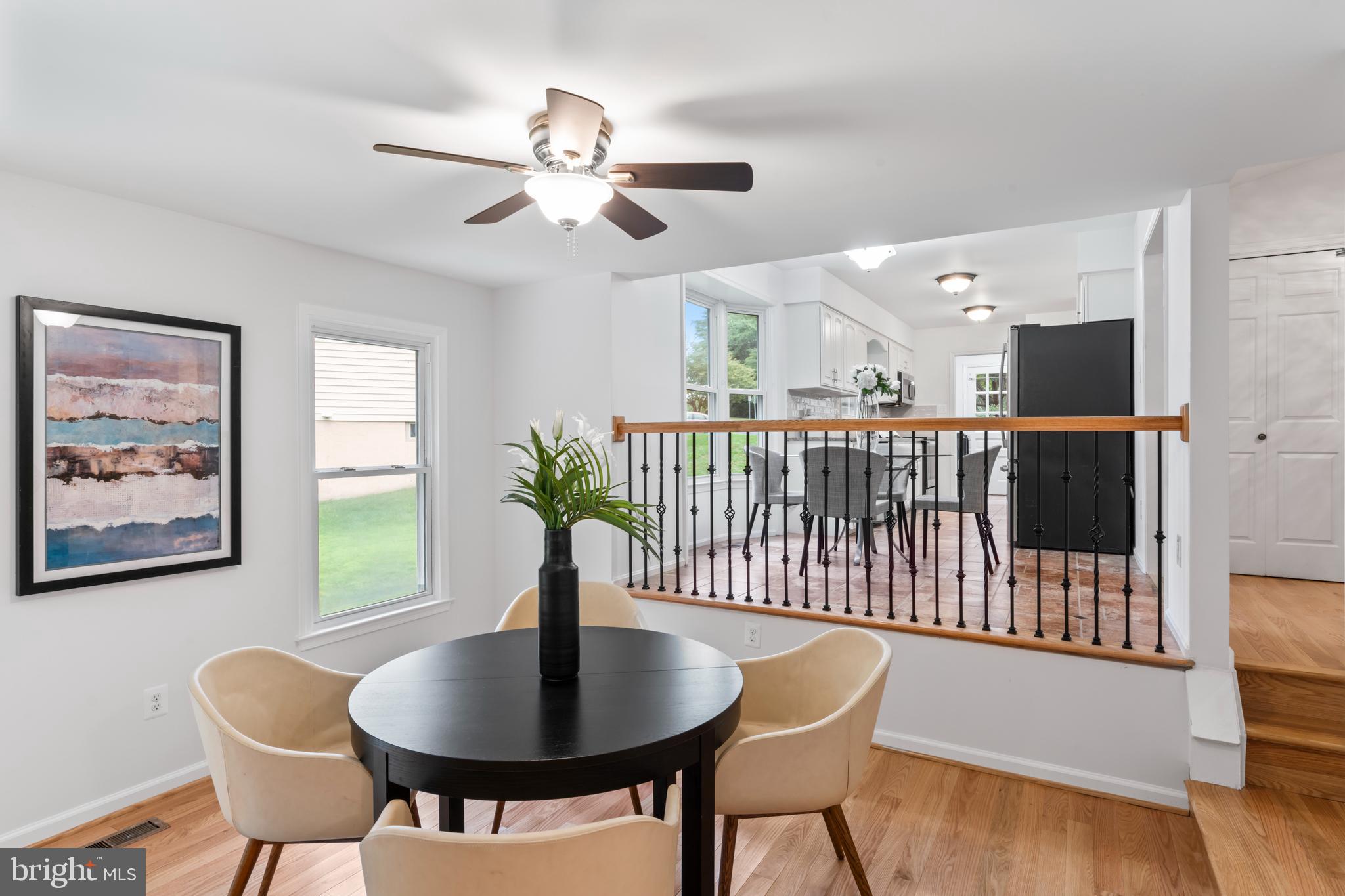 1950 Weybridge Lane Reston, VA 20191 - Photo 24 of 71 a view of a dining room with furniture window and wooden floor