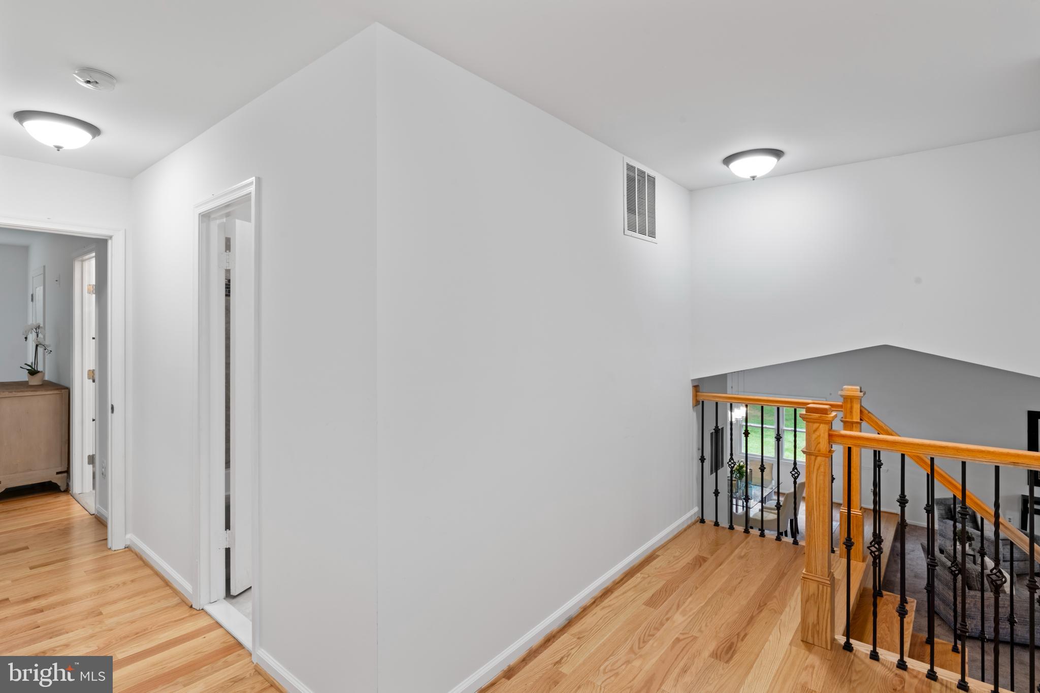 1950 Weybridge Lane Reston, VA 20191 - Photo 37 of 71 a view of a hallway with wooden floor