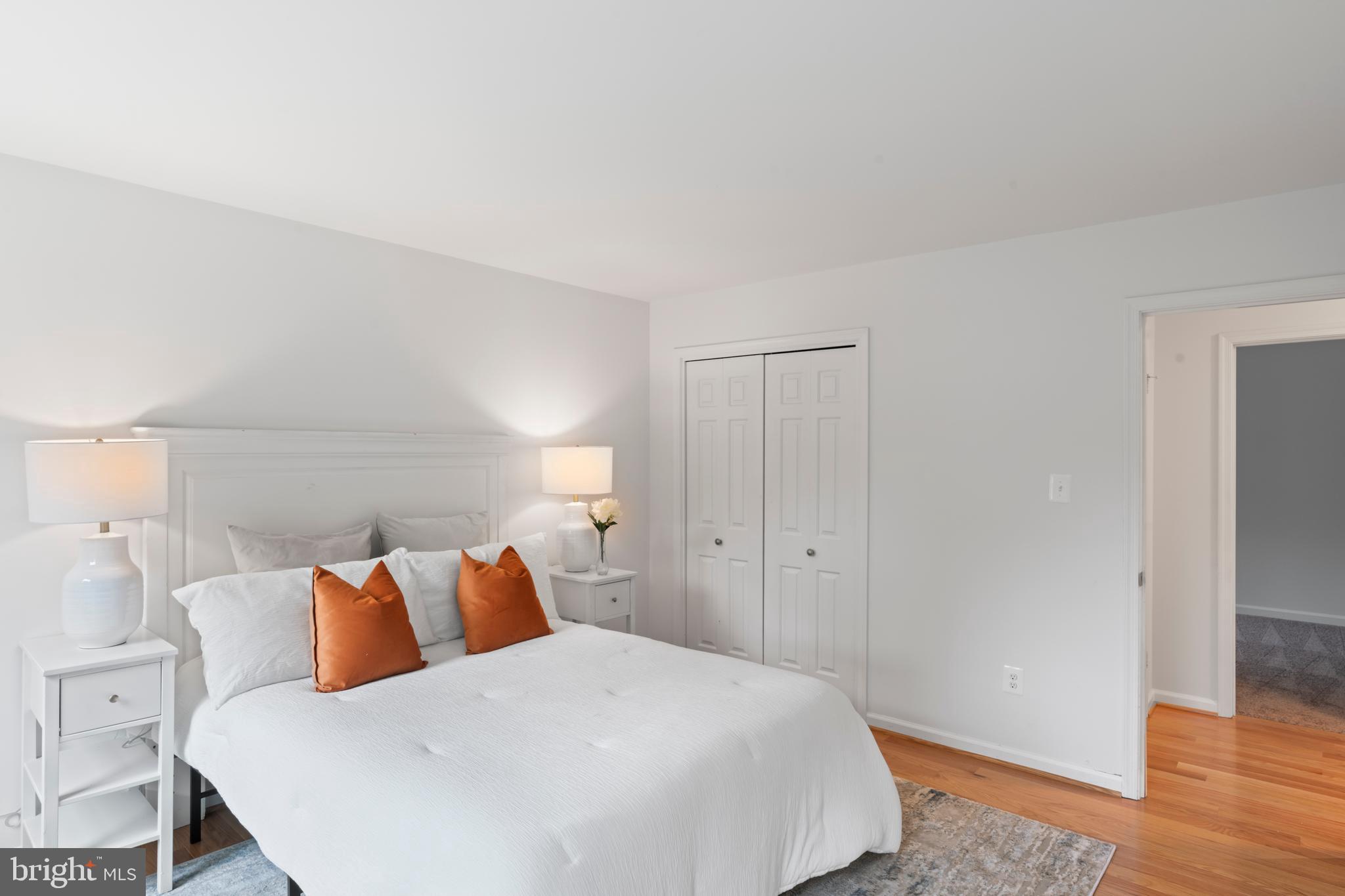 1950 Weybridge Lane Reston, VA 20191 - Photo 49 of 71 a bedroom with a bed and wooden floor