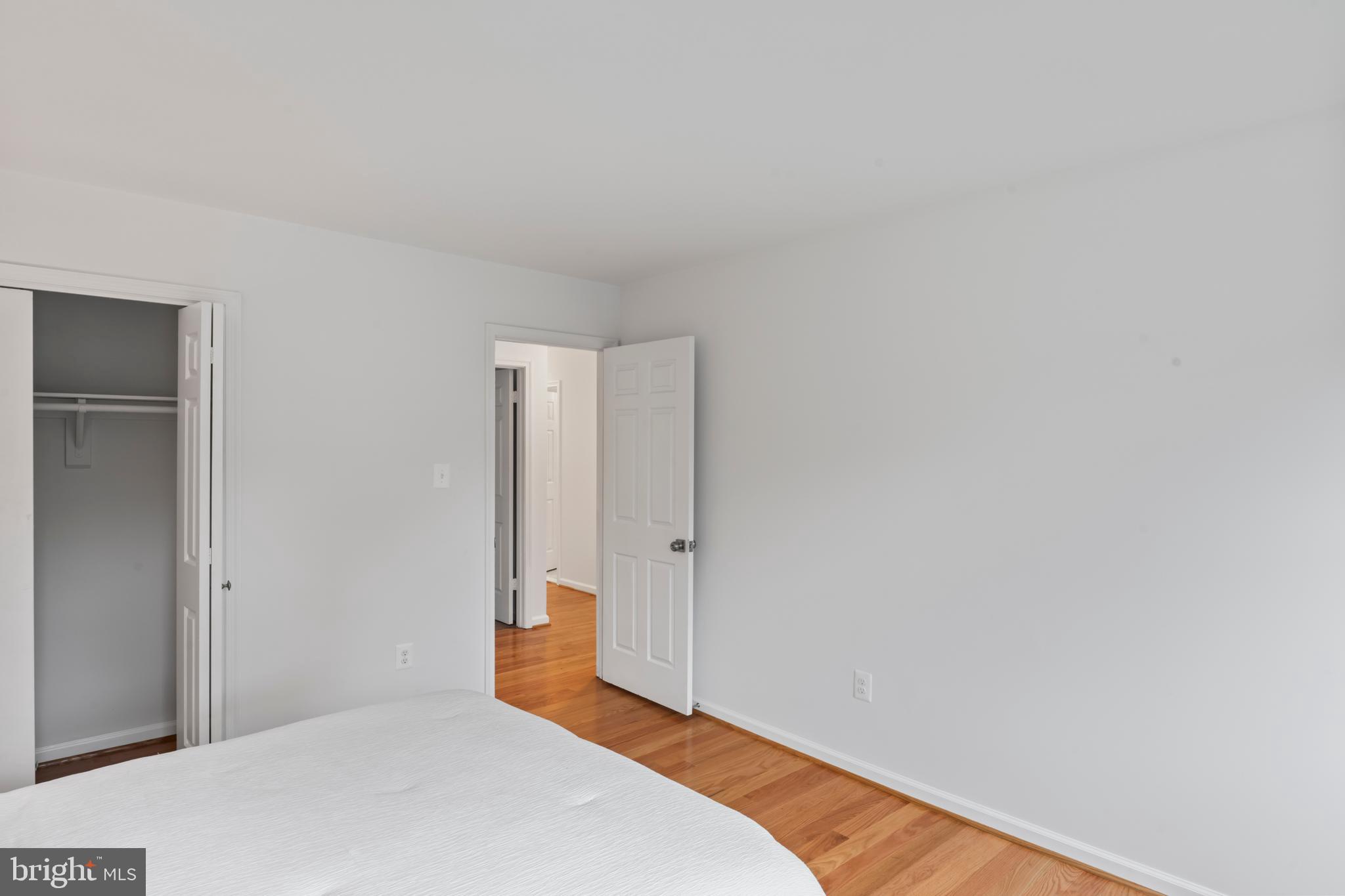 1950 Weybridge Lane Reston, VA 20191 - Photo 50 of 71 a bedroom with a bed and a closet