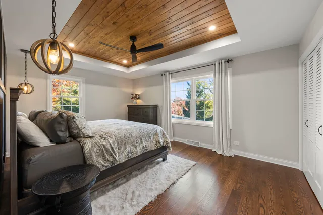 a spacious bedroom with a bed and a window