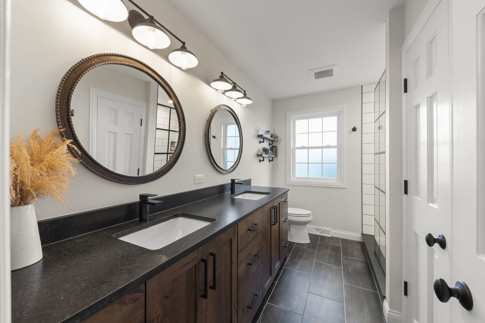 14340 Ridge Avenue Orland Park, IL 60462 - Photo 18 of 25 a bathroom with a granite countertop double vanity sink and a mirror