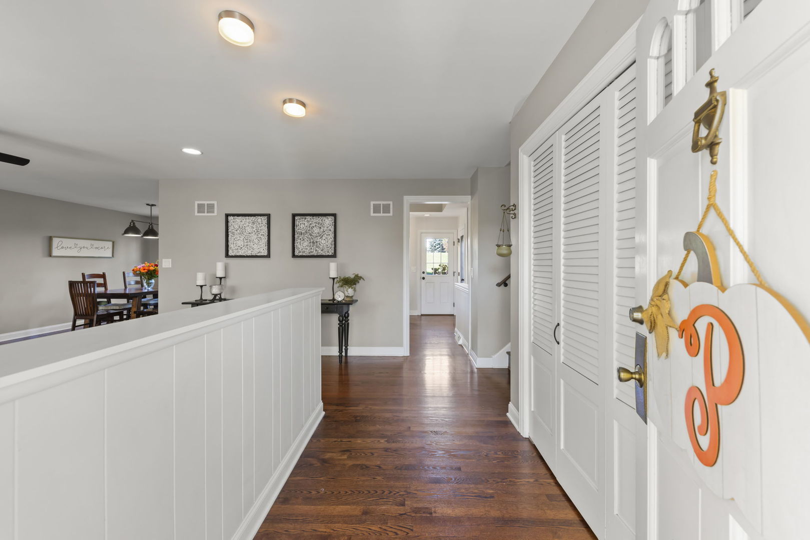 14340 Ridge Avenue Orland Park, IL 60462 - Photo 3 of 25 a hallway view with wooden floor and furniture
