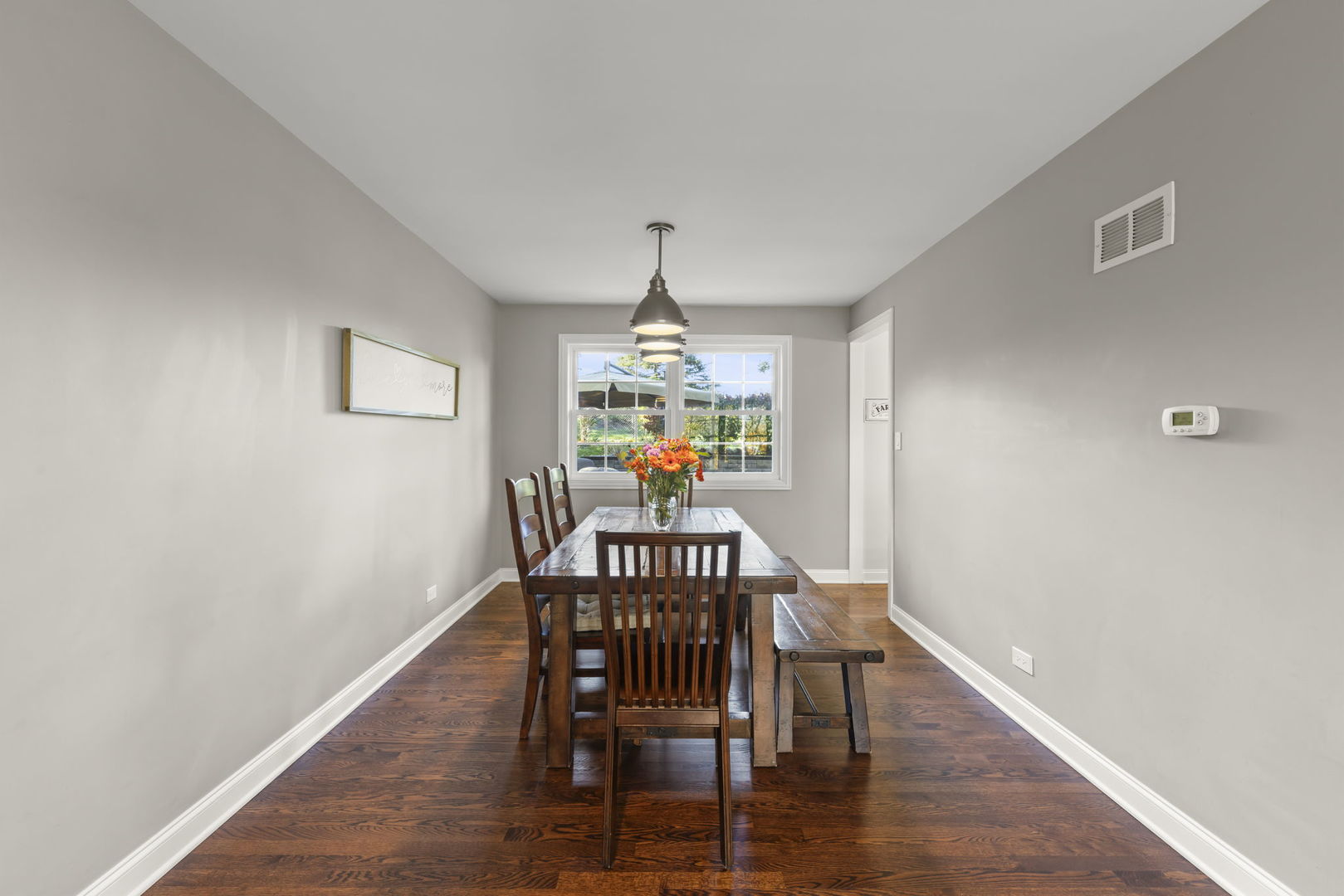 14340 Ridge Avenue Orland Park, IL 60462 - Photo 7 of 25 a view of a dining room with furniture window and wooden floor