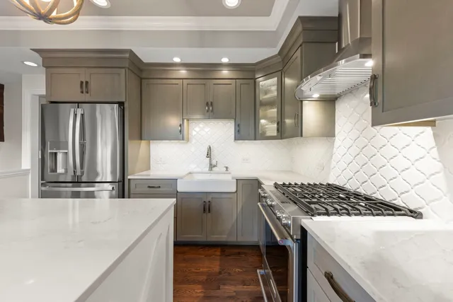 a kitchen that has a sink and a stove