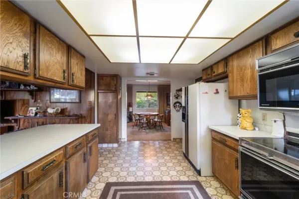 a spacious bathroom with double vanity and a mirror