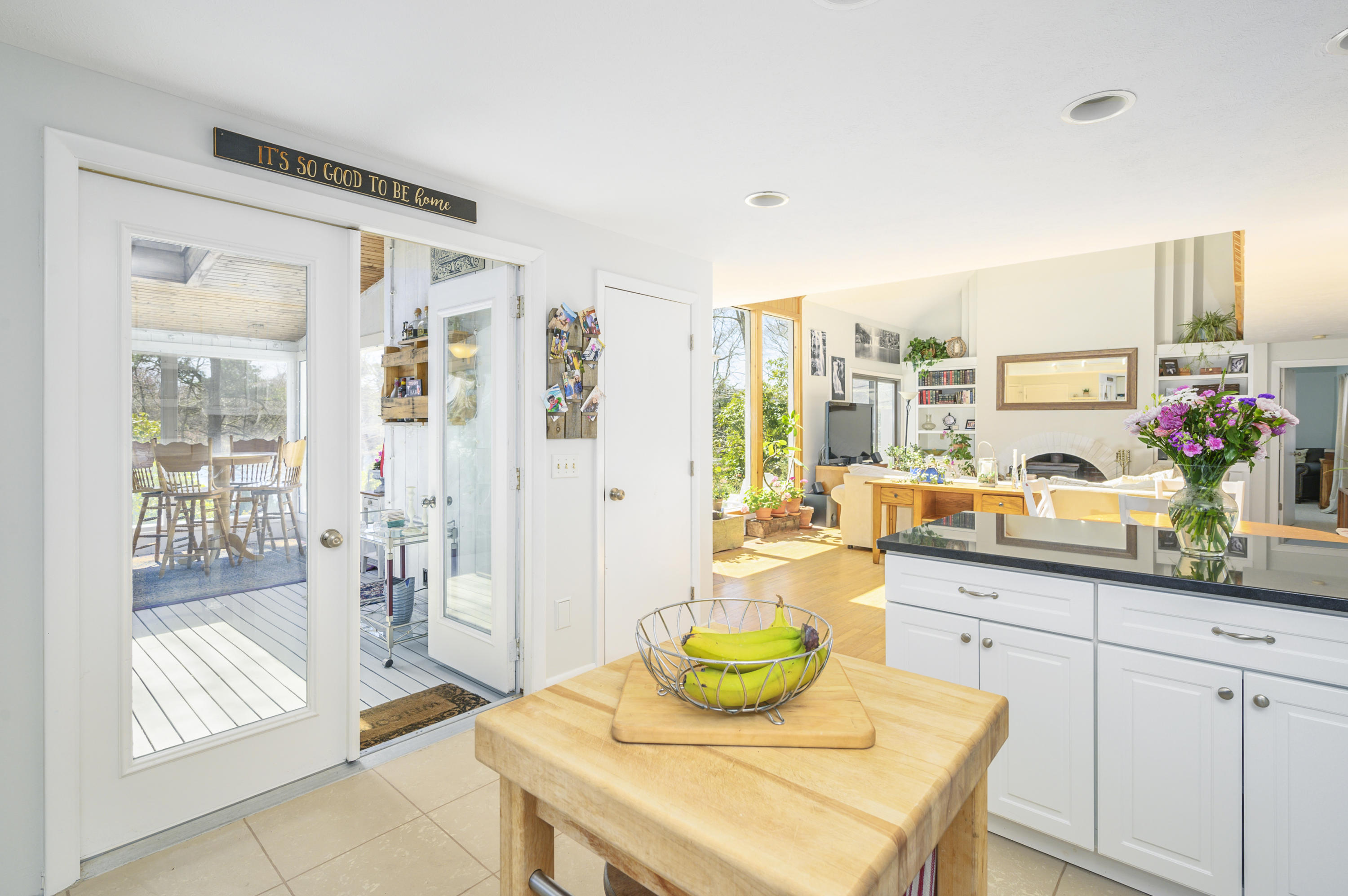 345 Holly Point Road Centerville, MA 02632 - Photo 13 of 28 a living room with furniture and a floor to ceiling window