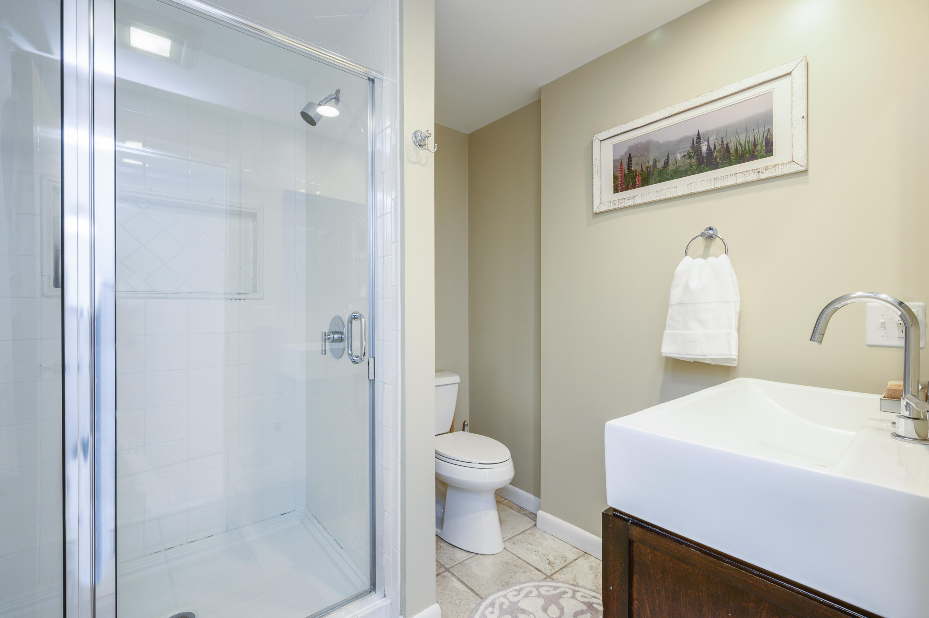 345 Holly Point Road Centerville, MA 02632 - Photo 19 of 28 a bathroom with a sink a toilet and shower