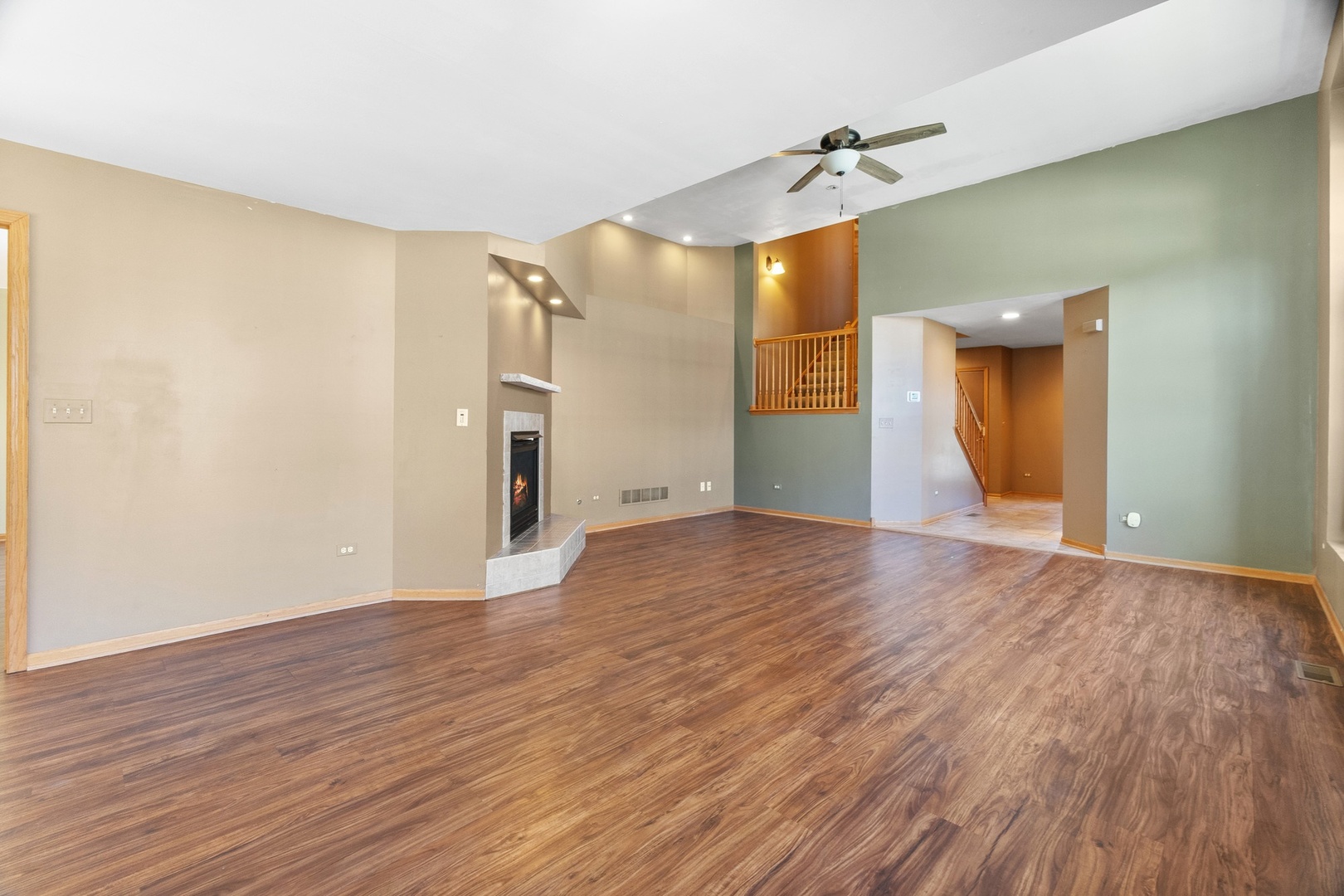 25593 O'Connel Lane Manhattan, IL 60442 - Photo 6 of 24 a view of a room with wooden floor and a ceiling fan