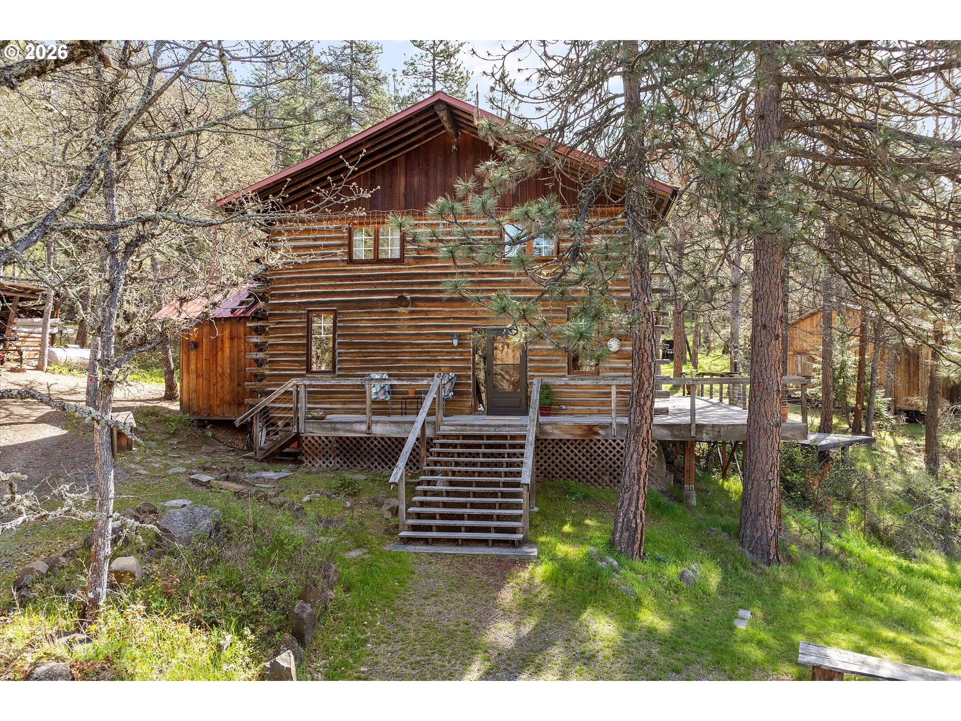 2215 Pine Oak Road Mosier, OR 97040 - Photo 1 of 46 a backyard of a house with lots of green space