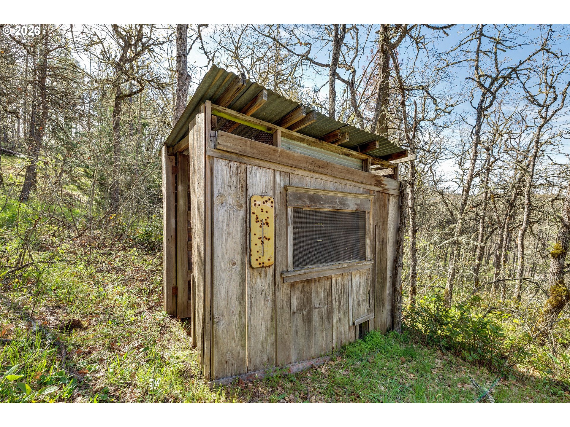 2215 Pine Oak Road Mosier, OR 97040 - Photo 20 of 46 a view of a house with a small yard and wooden fence