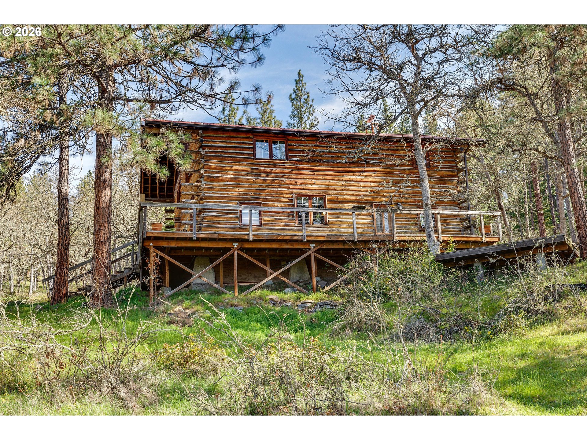 2215 Pine Oak Road Mosier, OR 97040 - Photo 21 of 46 a view of a backyard with wooden fence and a bench