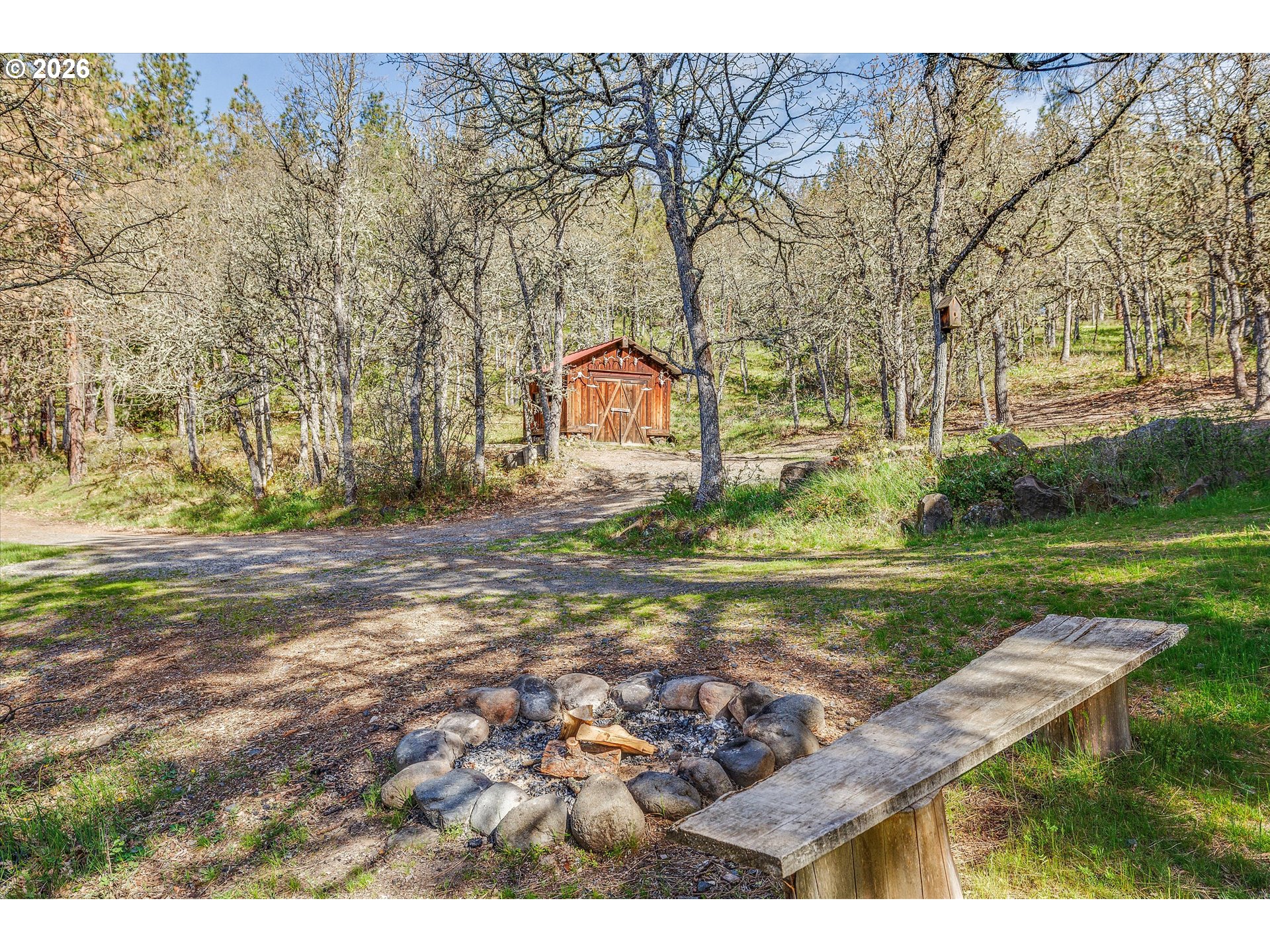 2215 Pine Oak Road Mosier, OR 97040 - Photo 22 of 46 a backyard of a house with lots of green space
