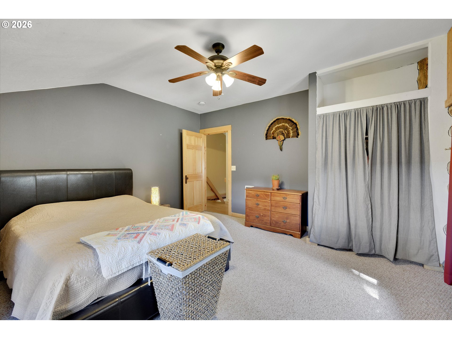 2215 Pine Oak Road Mosier, OR 97040 - Photo 38 of 46 a bedroom with a bed and a chandelier