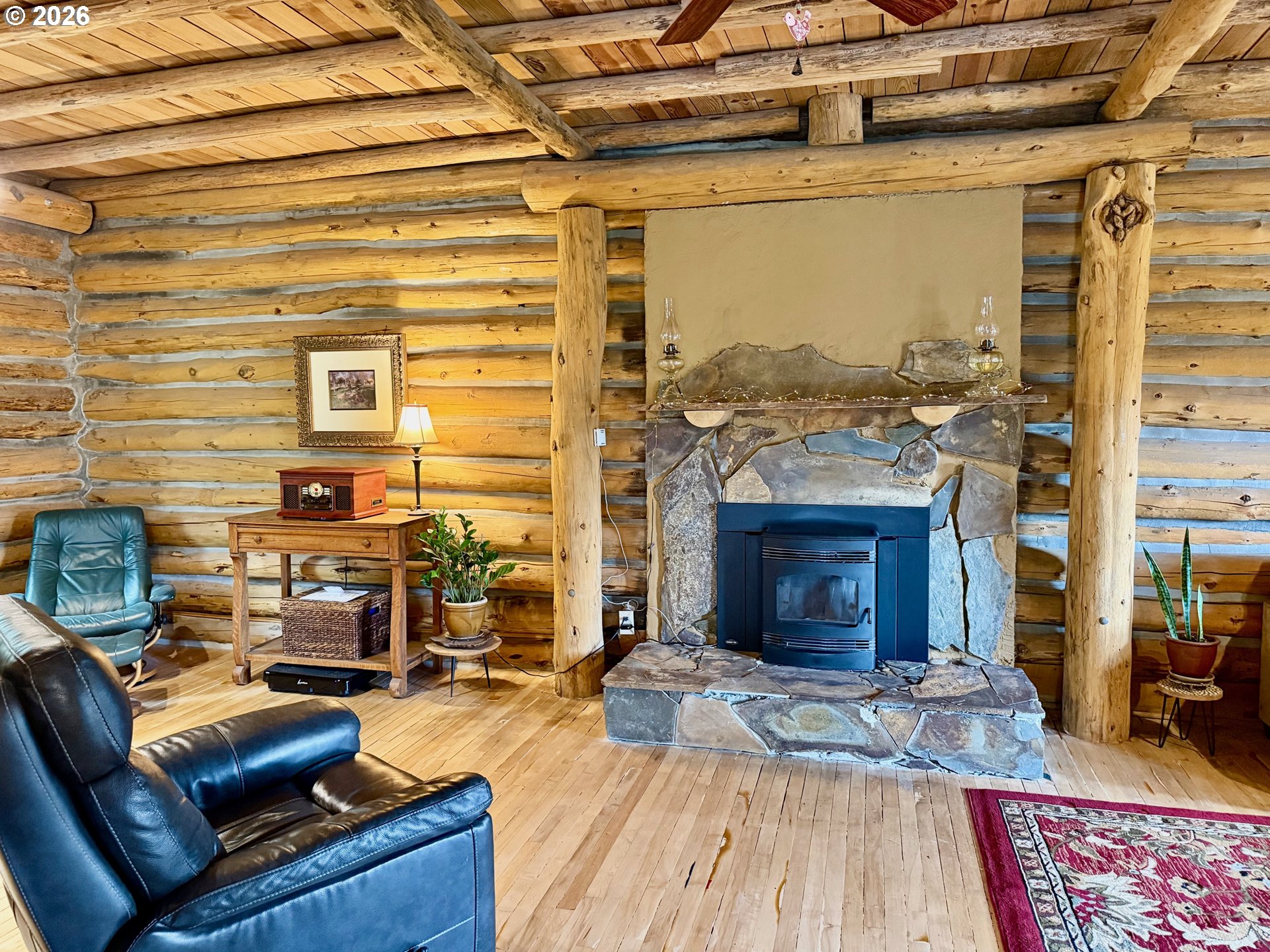 2215 Pine Oak Road Mosier, OR 97040 - Photo 5 of 46 a living room with furniture and a fireplace