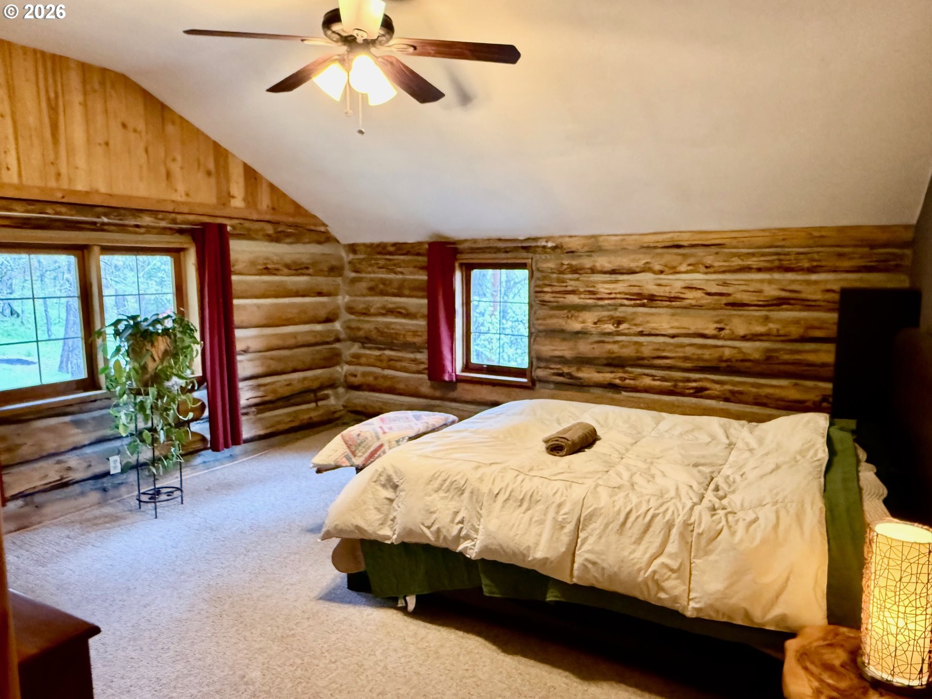 2215 Pine Oak Road Mosier, OR 97040 - Photo 7 of 46 a bed sitting in a room next to a window