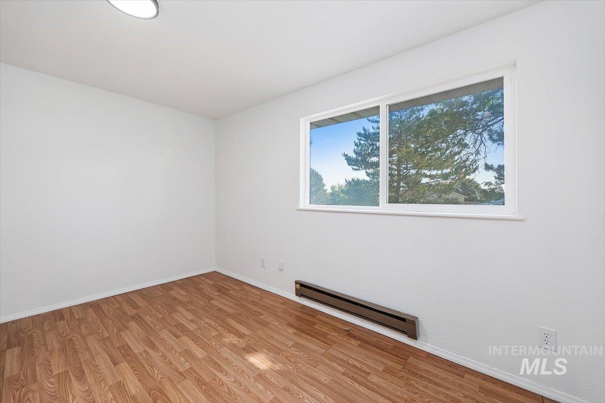 259 Pheasant Road, Unit 84 Twin Falls, ID 83301 - Photo 16 of 25 Room featuring light wood-finish flooring, white walls, and a large window with white trim