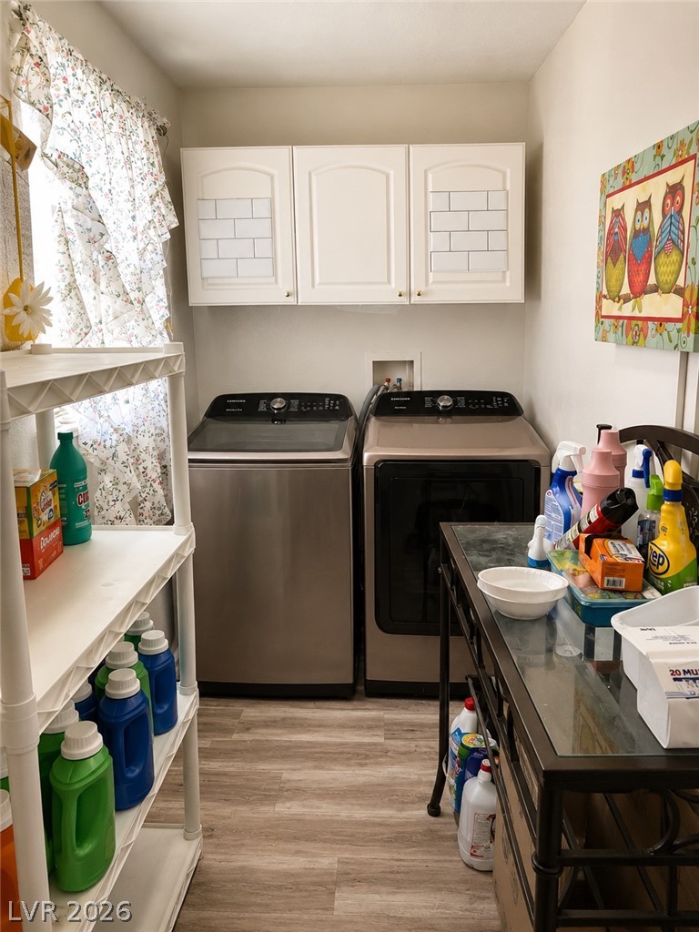 200 East Gamebird Road Pahrump, NV 89048 - Photo 11 of 23 Functional laundry space featuring modern appliances and practical storage solutions.
