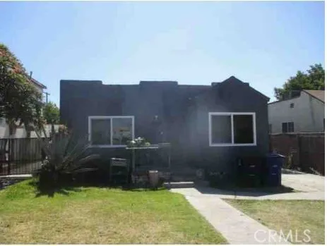 a view of house with yard and green space
