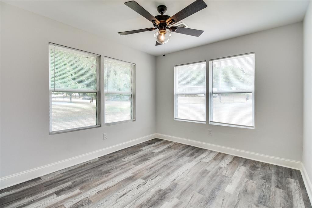 1201 Ridgewood Road Denison, TX 75020 - Photo 24 of 29 Unfurnished room with ceiling fan and light hardwood / wood-style flooring