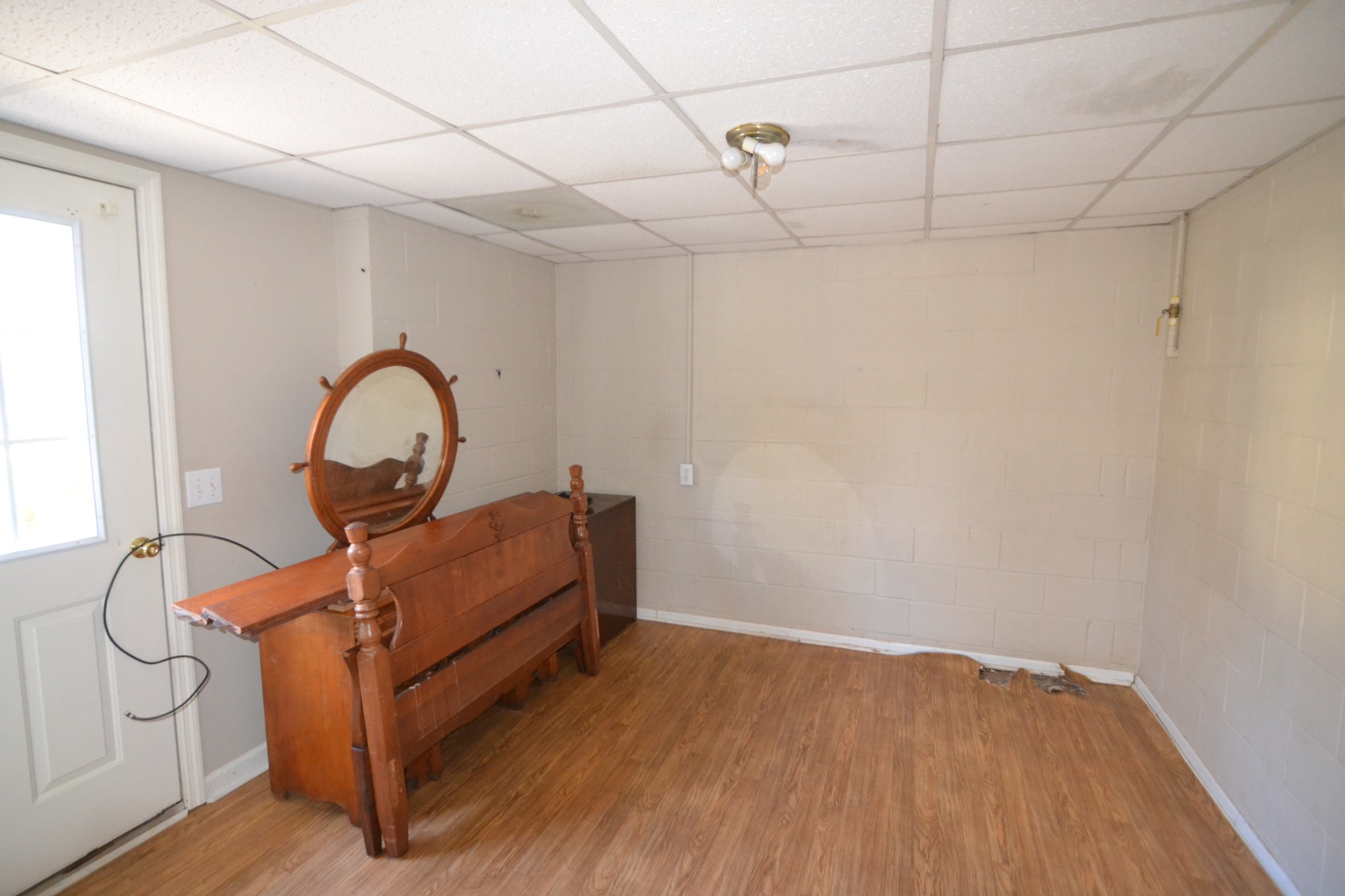 1283 Lake Logan Road Ardmore, TN 38449 - Photo 7 of 8 a room with wooden furniture and a window