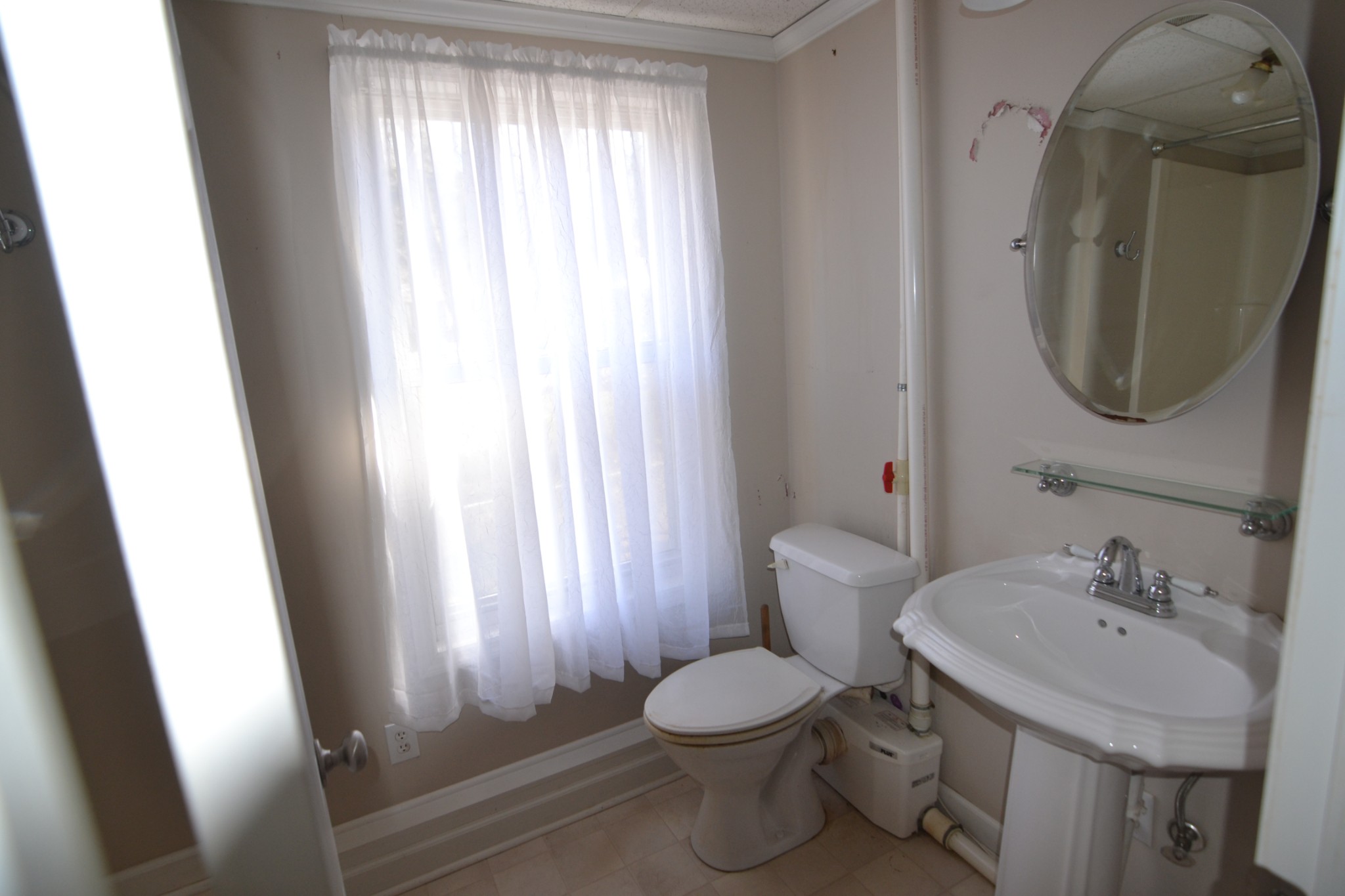 1283 Lake Logan Road Ardmore, TN 38449 - Photo 8 of 8 a bathroom with a sink and a mirror