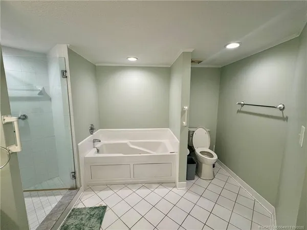 a bathroom with a sink a toilet and a shower