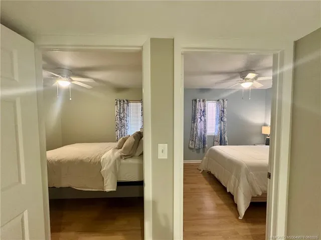 a bedroom with a bed and a mirror