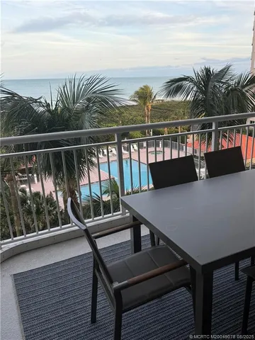 a view of a balcony with chairs