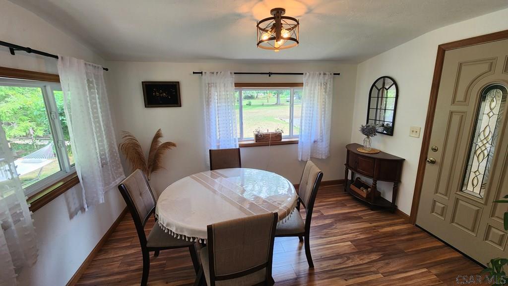 891 Shaffer Run Road Fairhope, PA 15538 - Photo 3 of 38 a view of a dining room with furniture window and wooden floor