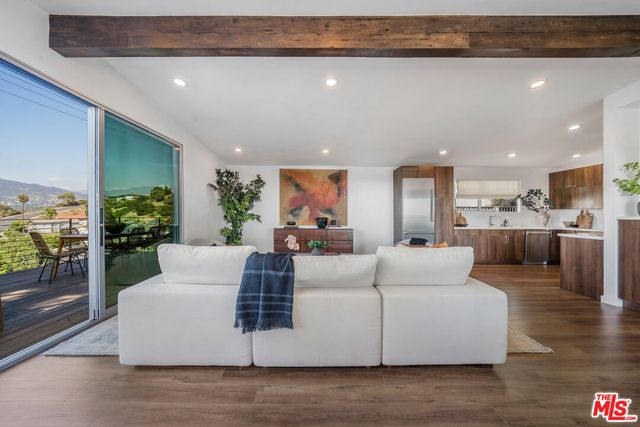 a view of backyard with a patio and wooden flooring